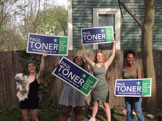 campaign workers with signs